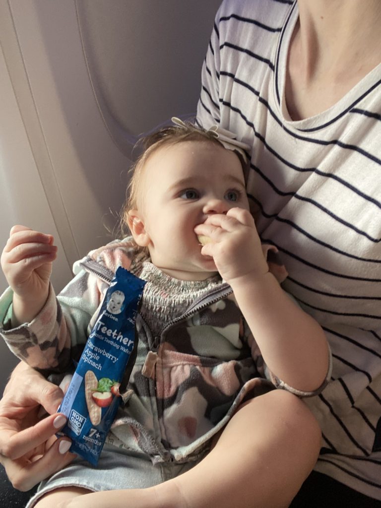 baby eating on plane